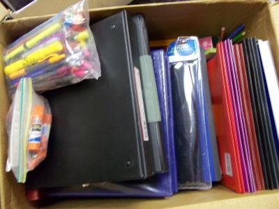 Box with assorted office supplies