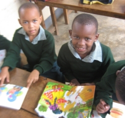Children reading books at Moshi