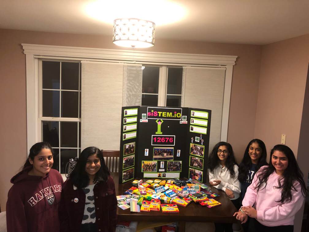 Robotics team donate school supplies