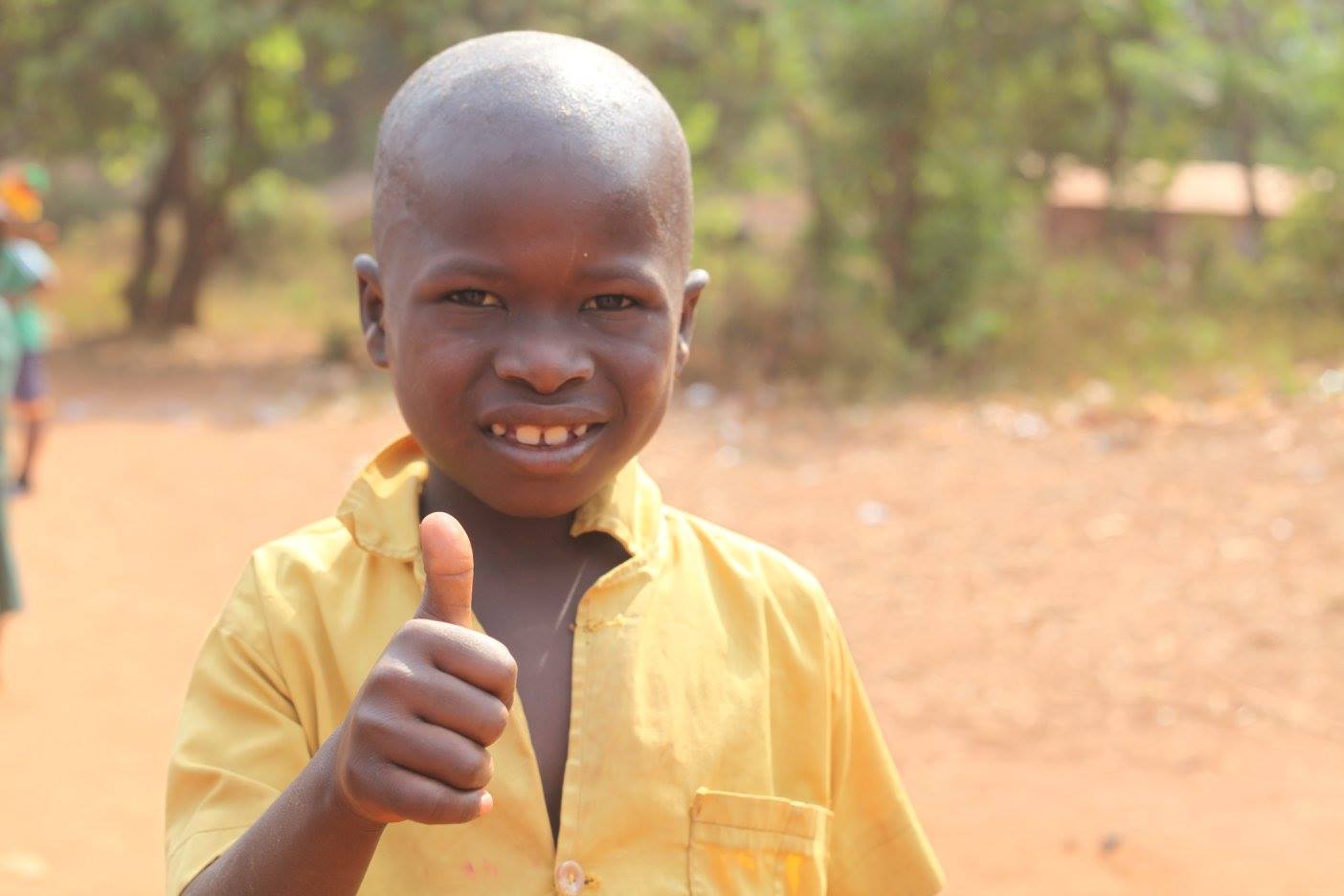 Young boy giving thumbs up 