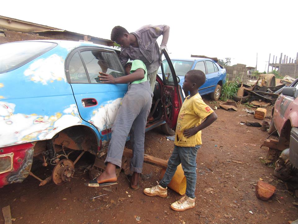 Nebimi working at the garage