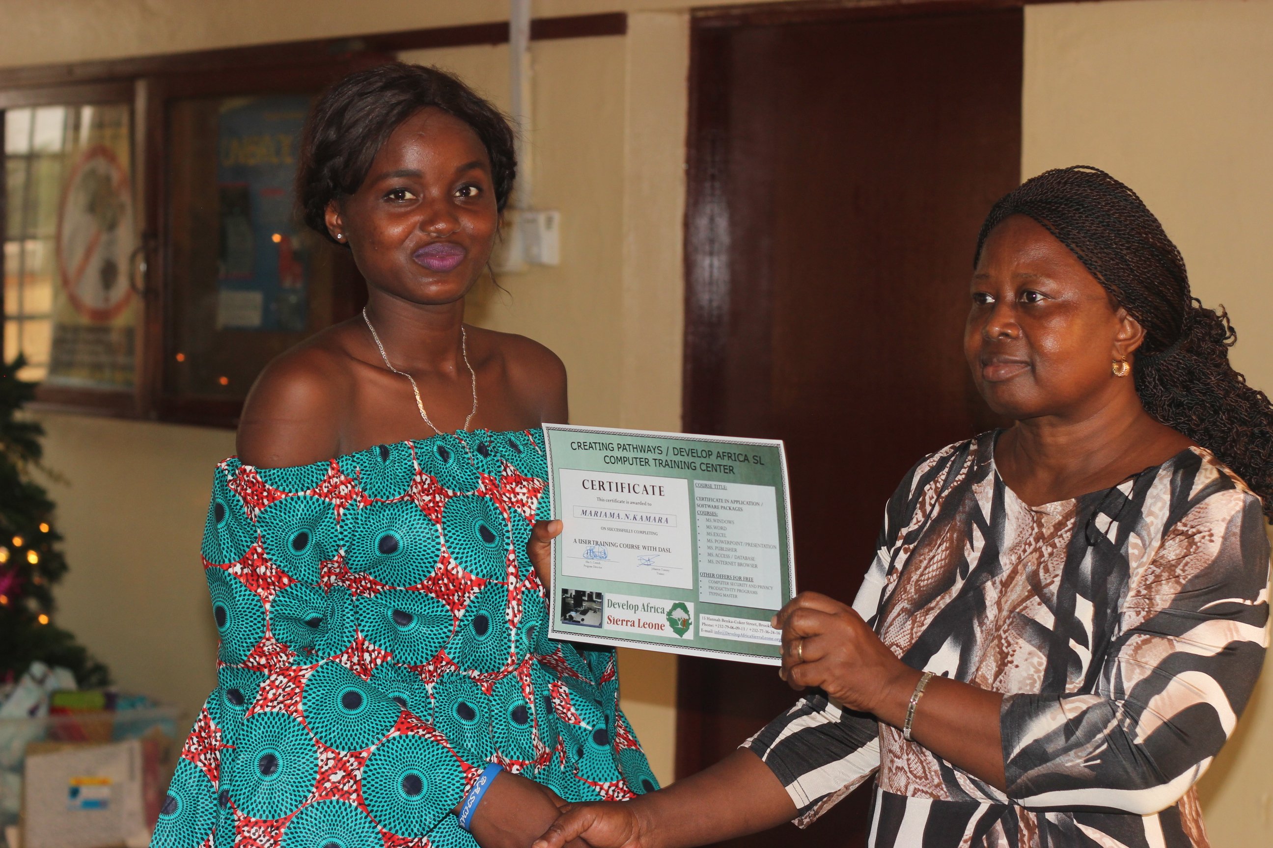 Aunty Janet giving out certificate to Mariama 