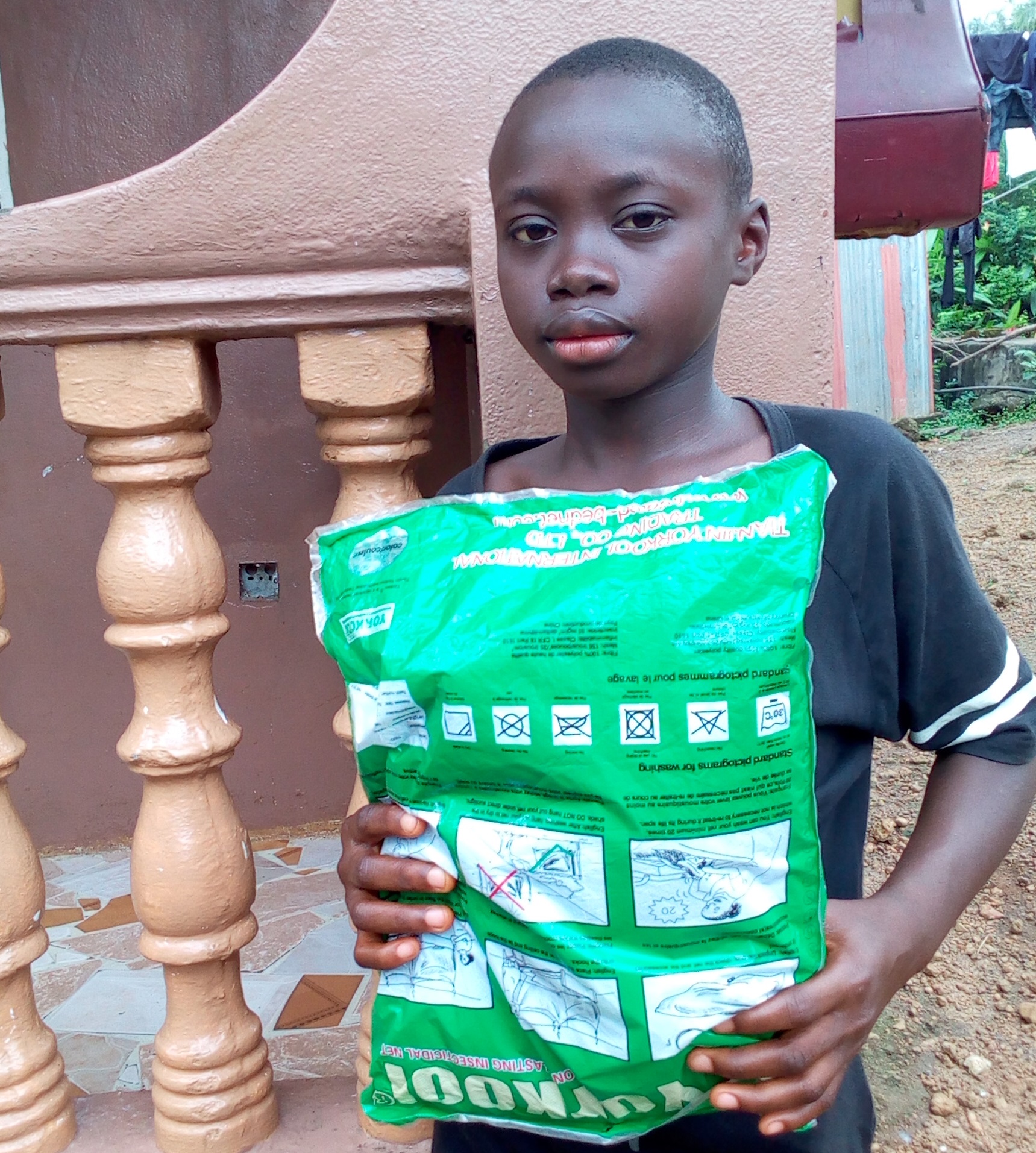 Baba Musa with bed net 