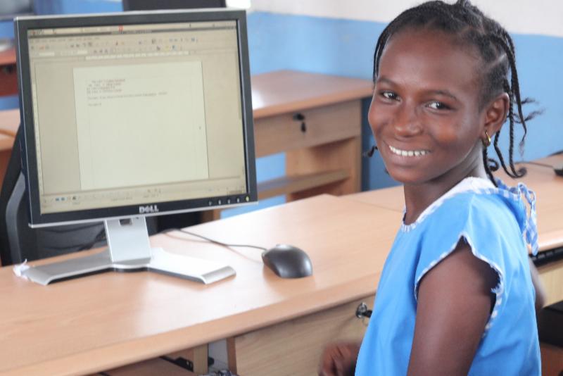 FAWE students with computers 