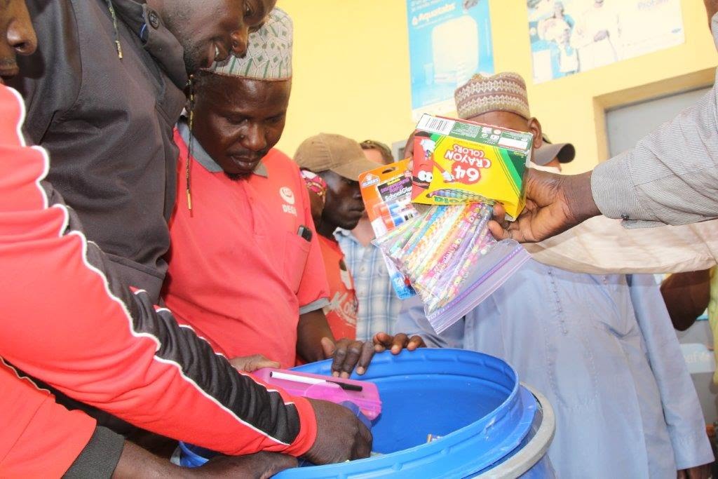 Distributing school supplies 
