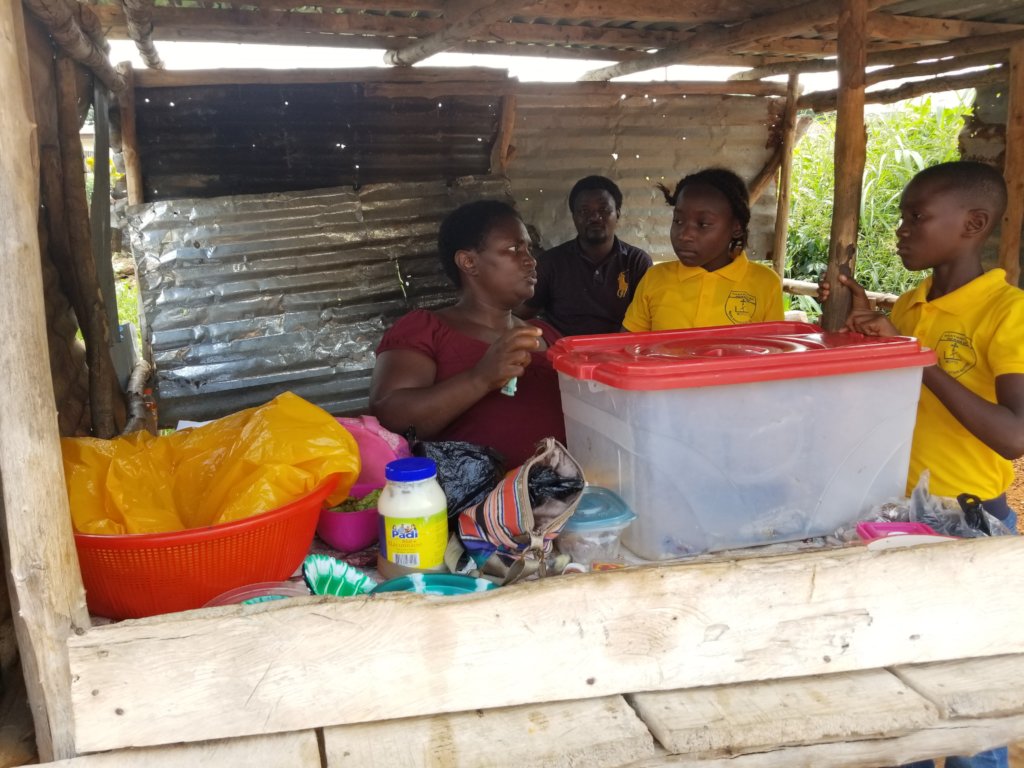Develop Africa Coordinator Visits Microfinance Beneficiary