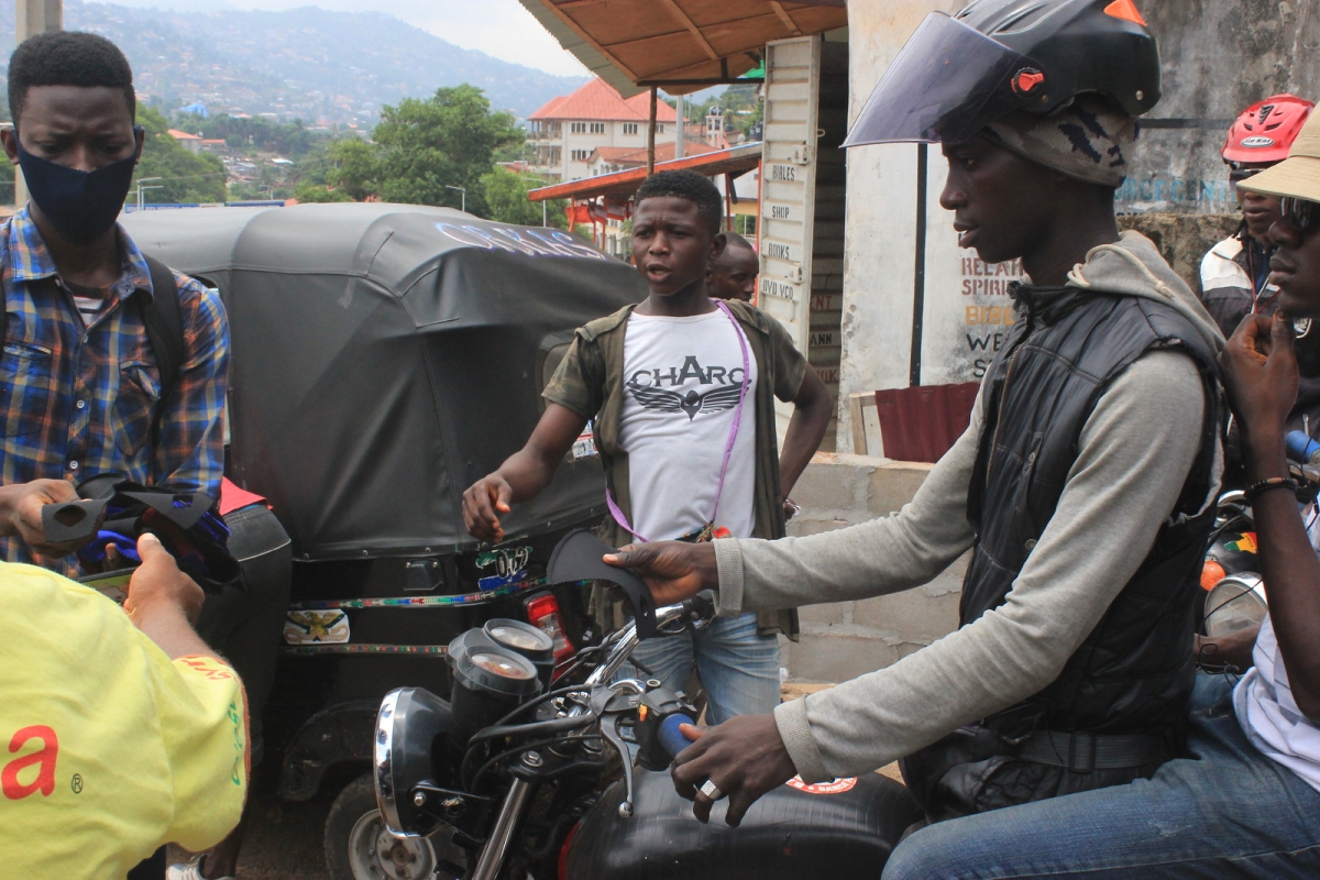 Providing cloth masks to bike riders 