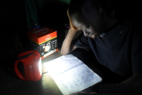 Student studying with solar lights 