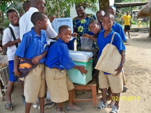 Mary selling at a local school