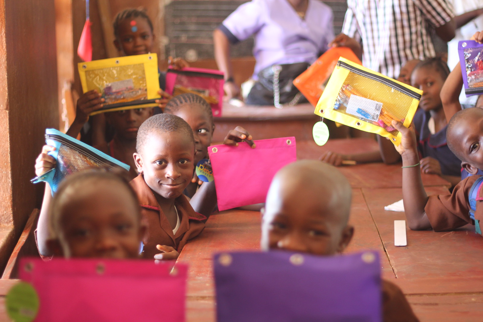 Kids with donated school supplies 
