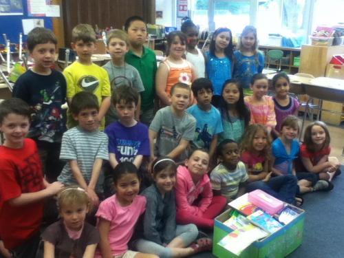 Class photo with school supplies