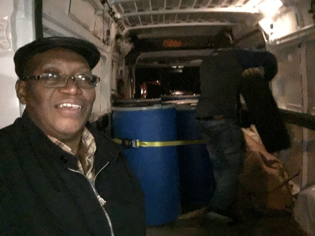 Sylvester and others packing supplies to be shipped out.