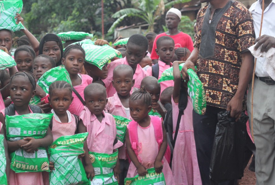 (c) Develop Africa. A group of children holding their mosquito nets
