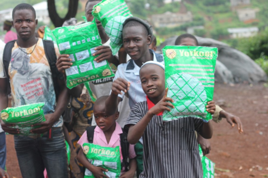 (c) Develop Africa. Children showing off their newly acquired mosquito net
