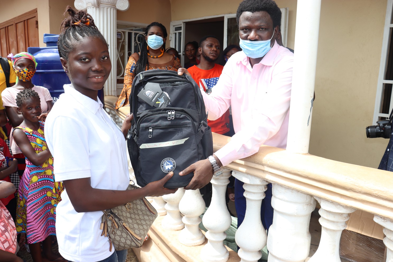 Develop Africa showing academic support by providing a school bag to Fatmata.