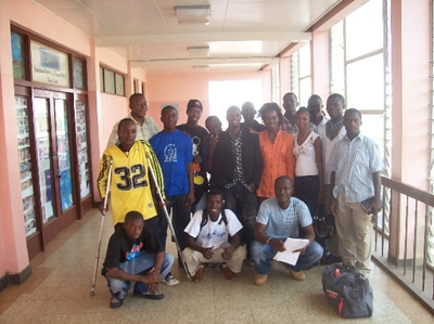 a group of young men and women stand together.