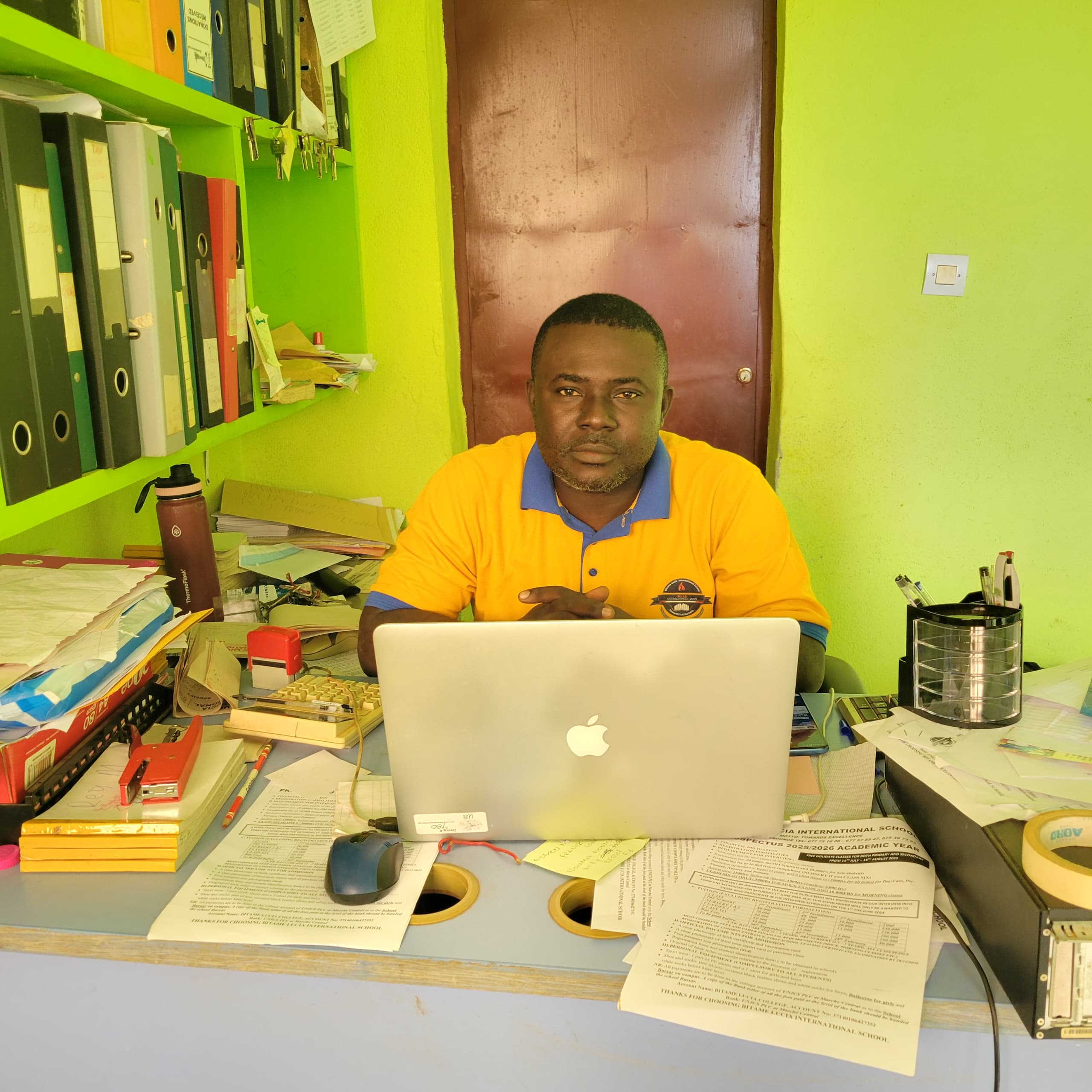 Teachers at Bitame Lucia International School using the new laptops