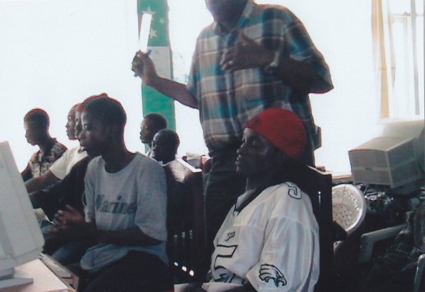 Sylvester interacting with the youths teaching them how to 