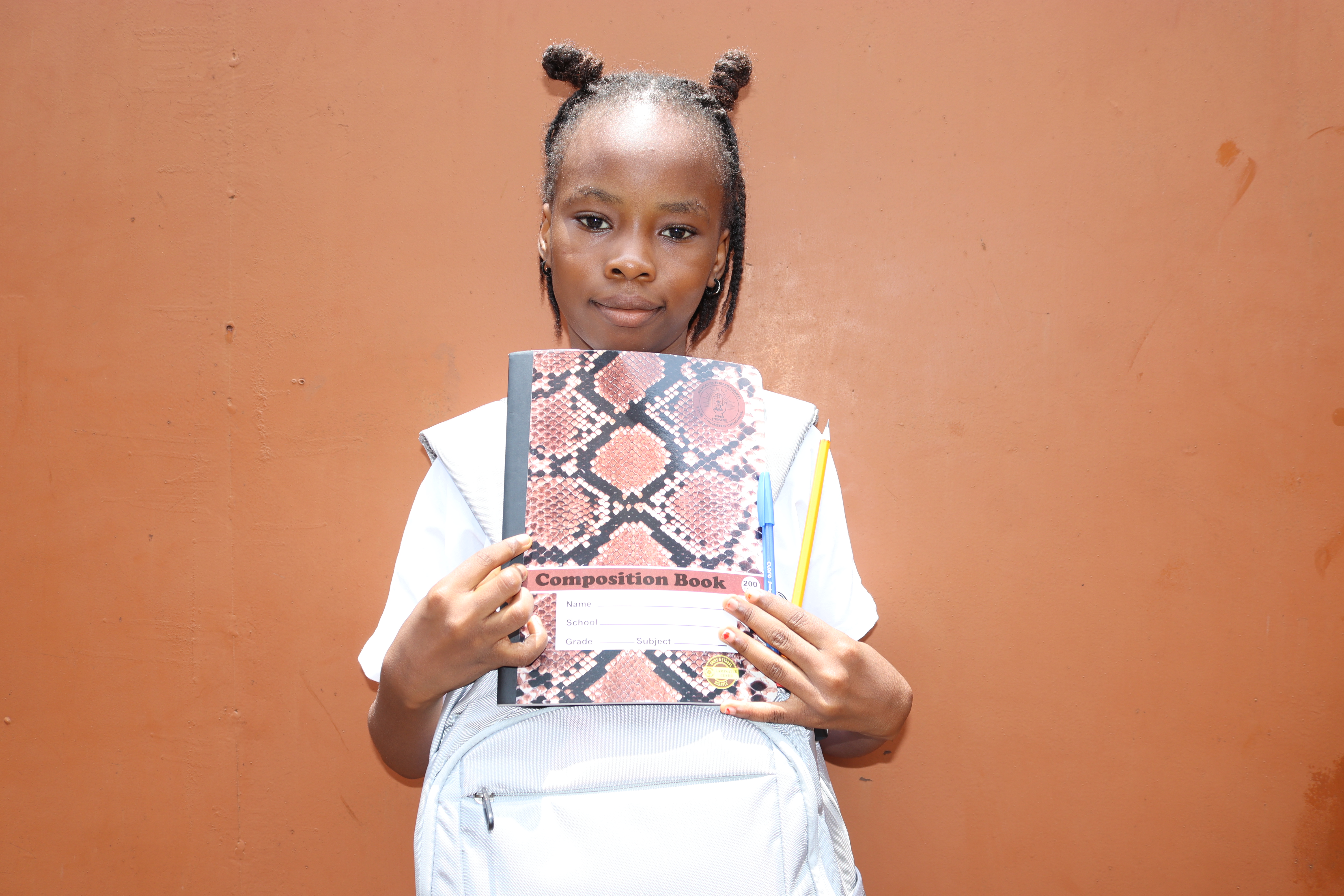 Marina with her school supplies