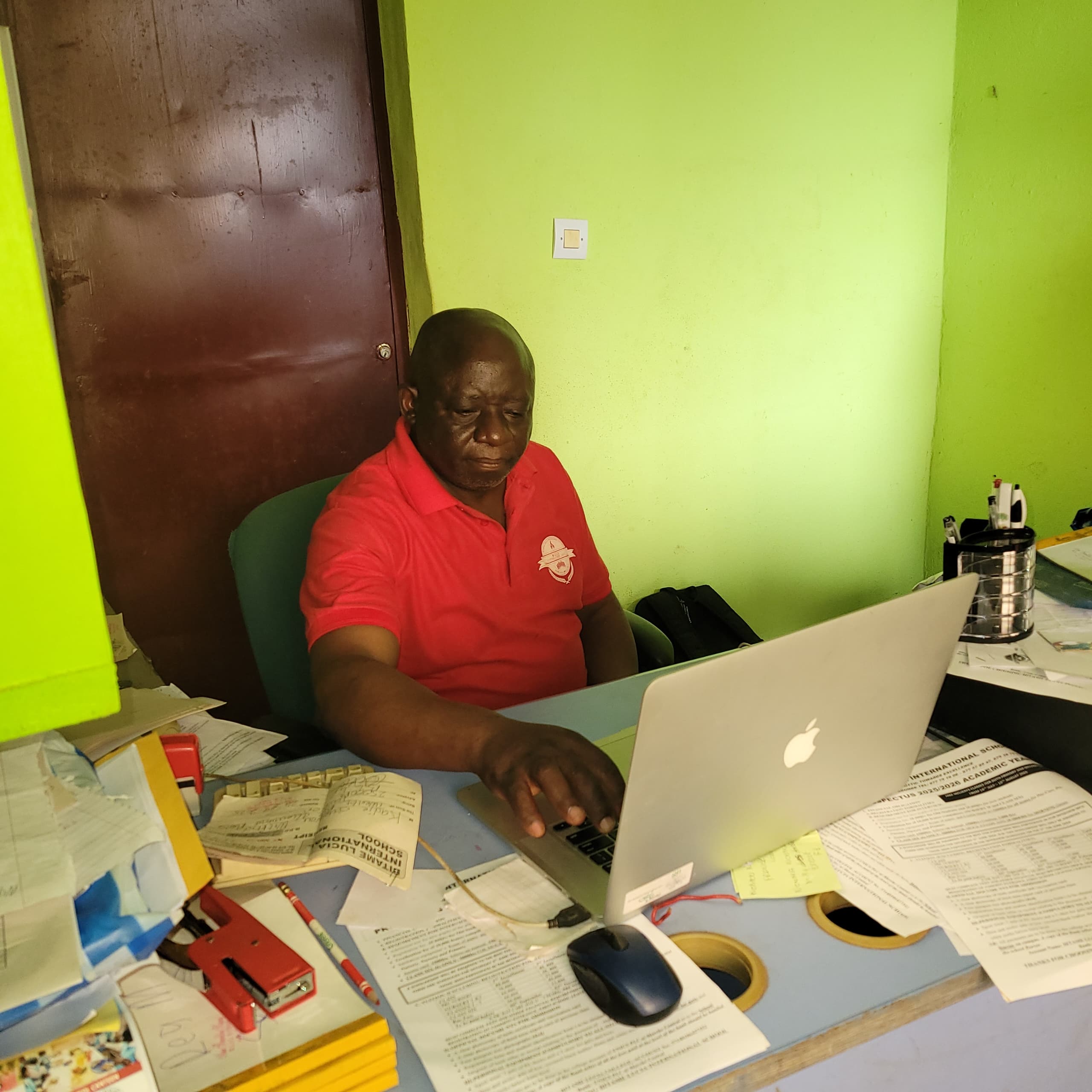 Teachers at Bitame Lucia International School using the new laptops