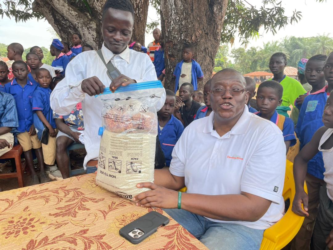 Sylvester with the community people of kamawornie