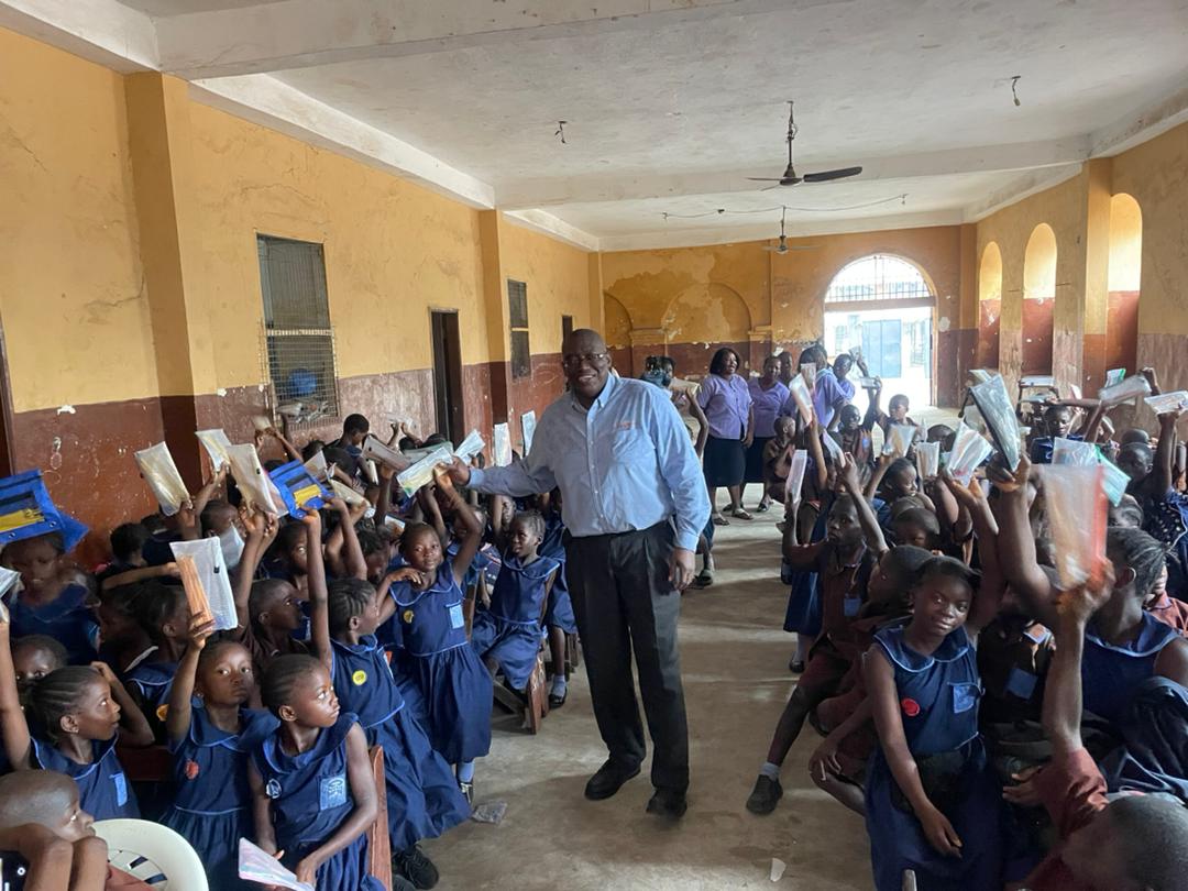 Sylvester Renner with kids at regent square on the year of te pencil campaign launch
