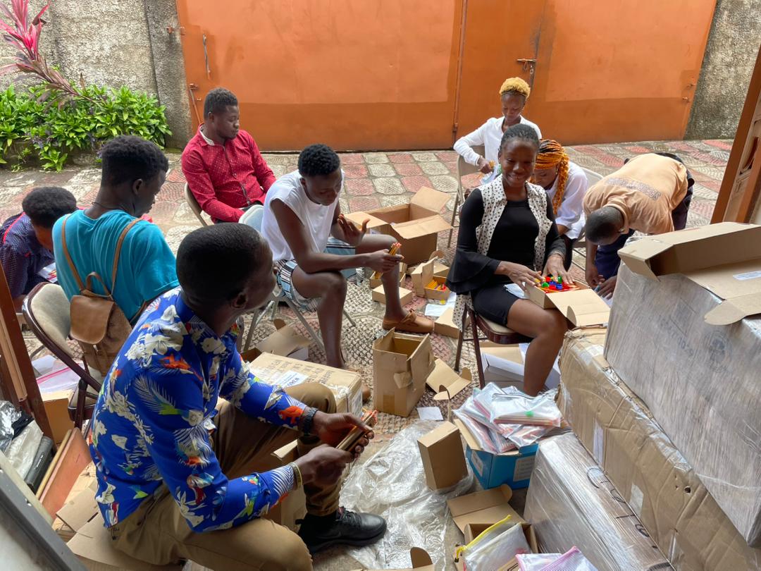 staffs and beneviciaries of develop africa packaging pencils