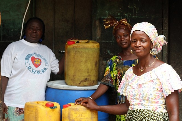 Women in Bo, Sierra Leone with a small retail cooking oil stock