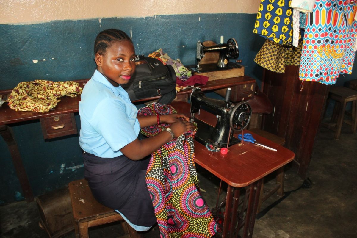 a girl learning tailoring