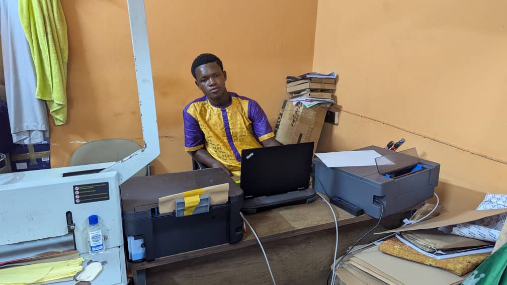 Joseph in his computer printing shop
