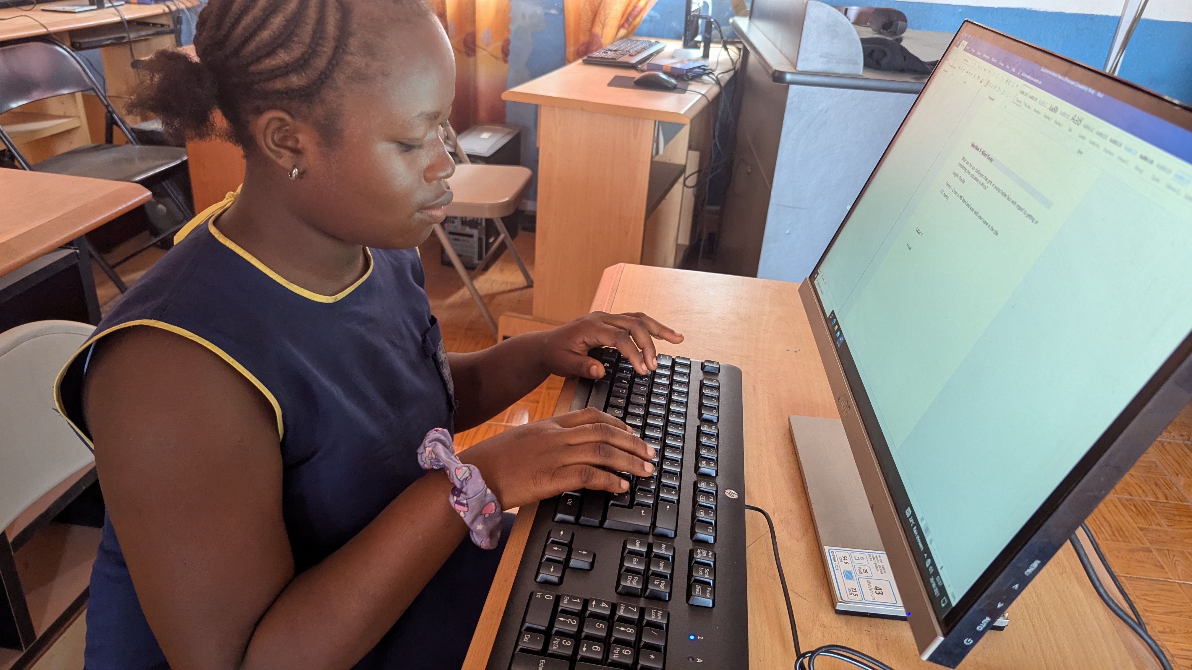 a-student-operating-a-computer-at-fawe-school-for-girls-in-sierra-leone.jpg