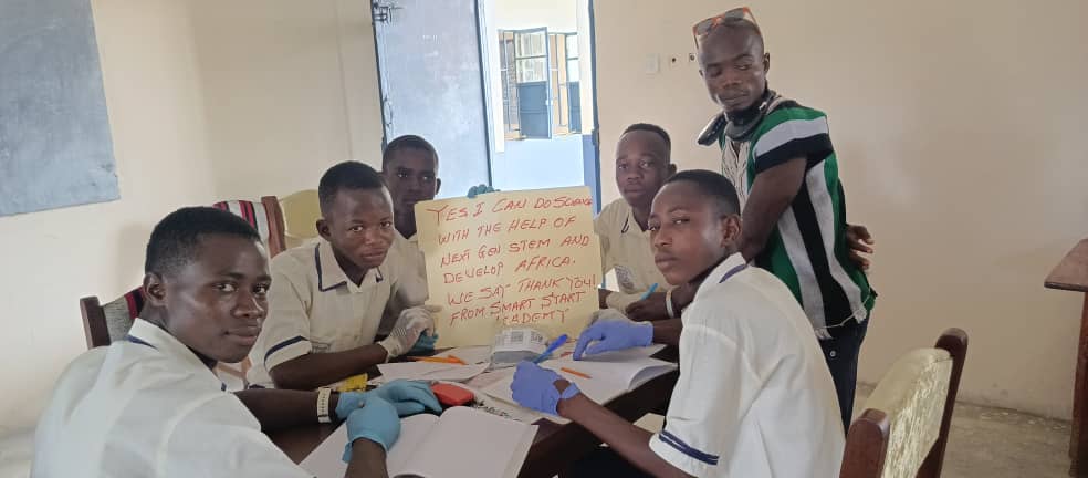 a-teacher-demonstrating-how-to-use-a-science-water-filtration-kit