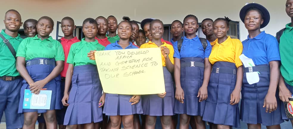 Students holding a handwriten banner thanking Develop Africa and NEXGEN STEM