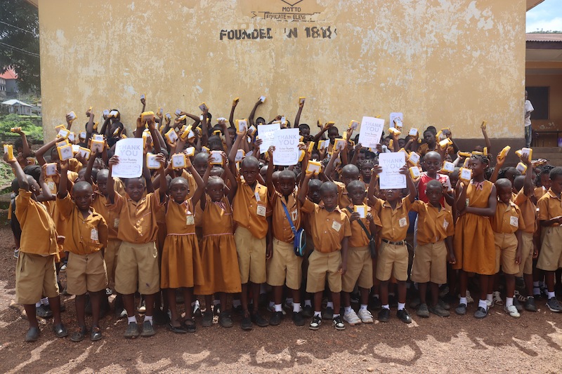 Kids with SolarBuddy lamps - REC Primary School, Sierra Leone - July 2026