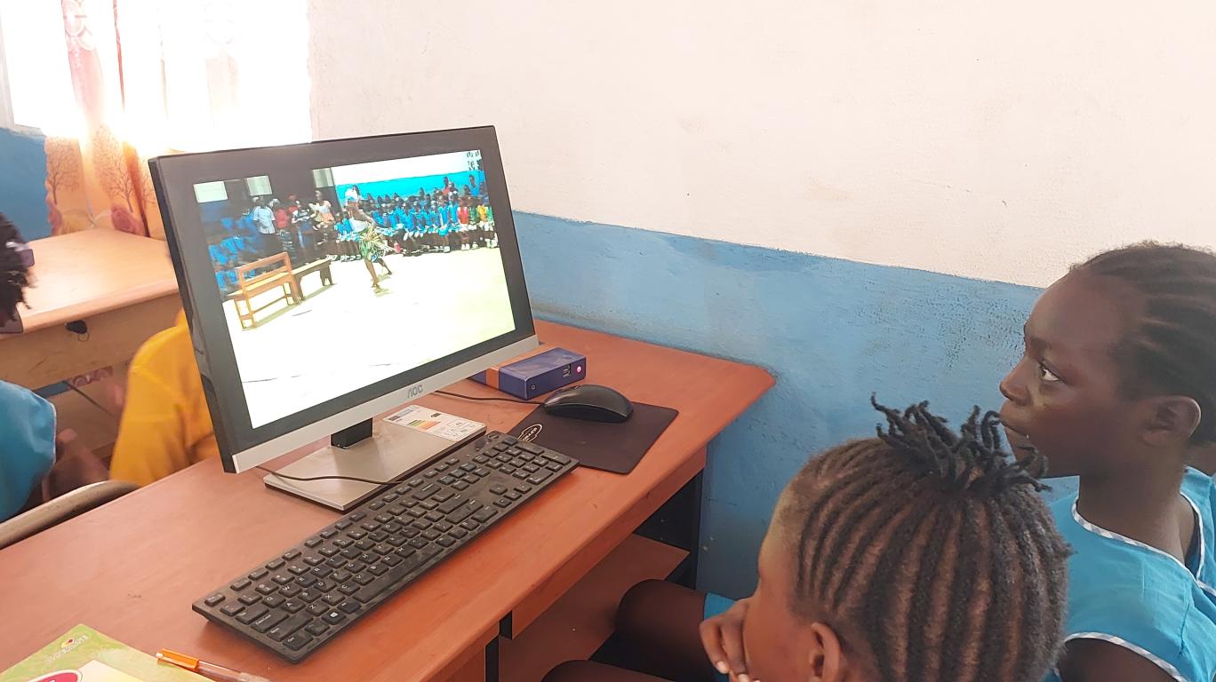 Marian & Roseline show what they are learning in computer class