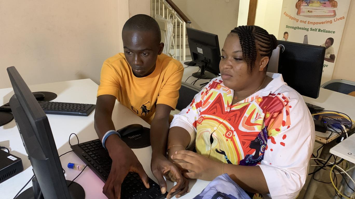 Teacher and student in computer training