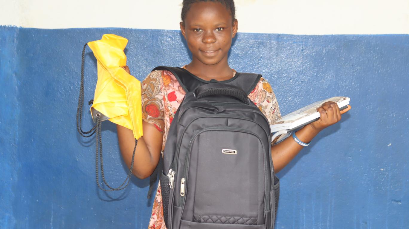 Milicent with her new school supplies