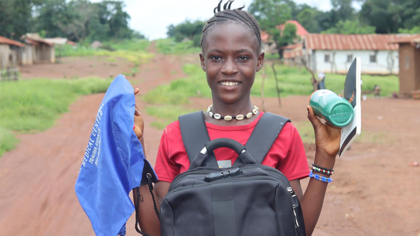 Girl with School Supplies