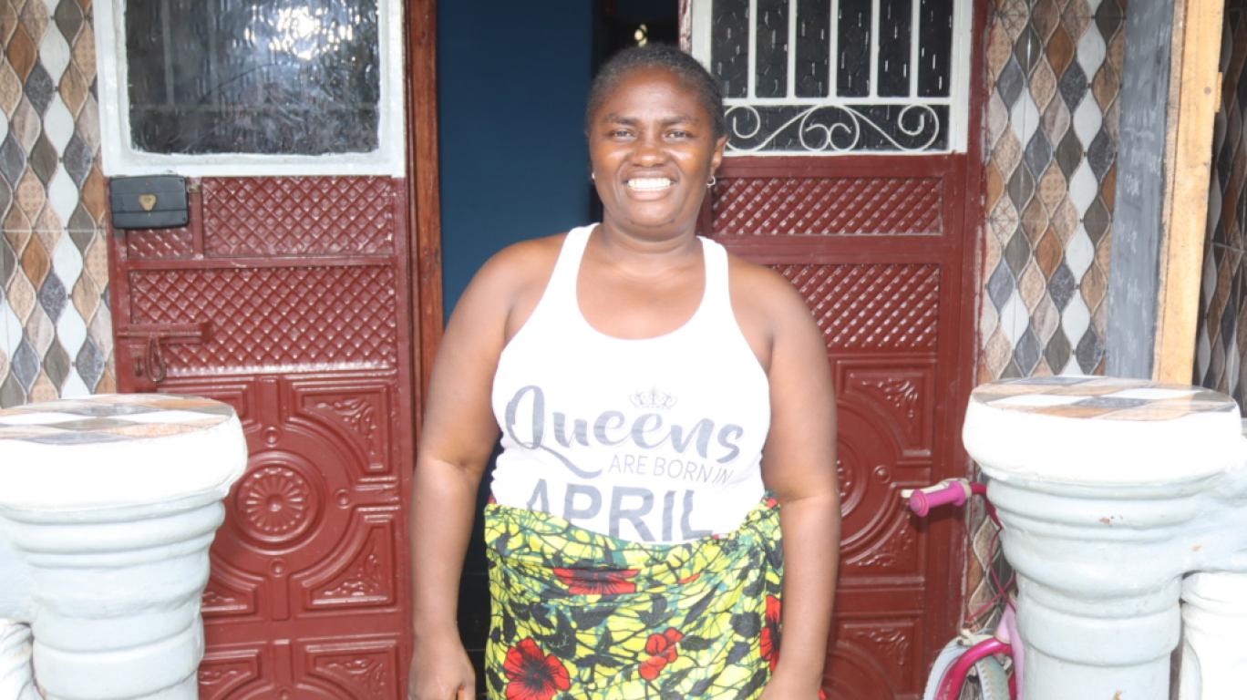 Mariatu outside her business