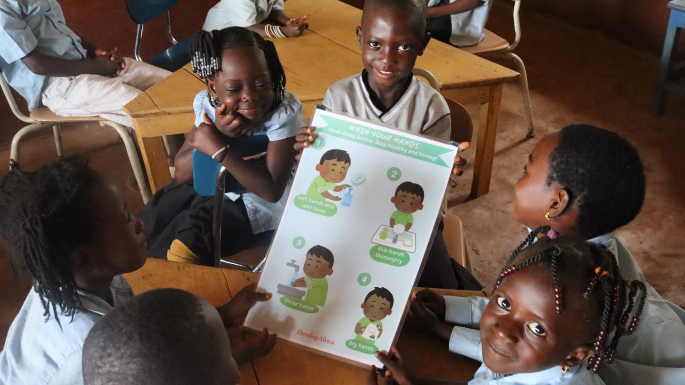 Kamawornie students with their new handwashing poster