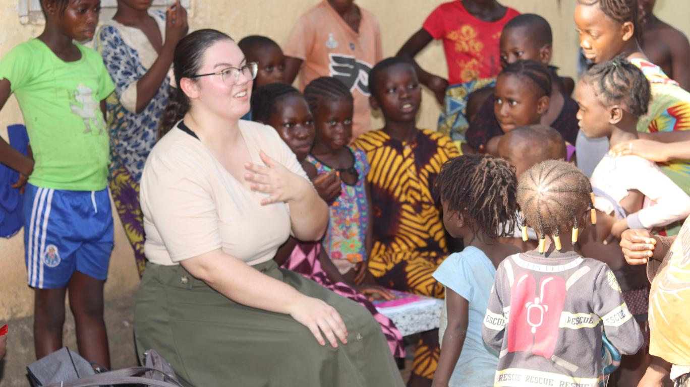 Olivia visiting with the Kamawornie Village children
