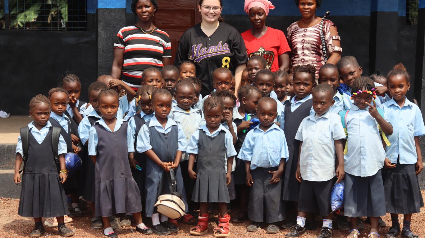 Olivia at the Kamawornie Nursery School with teachers and students