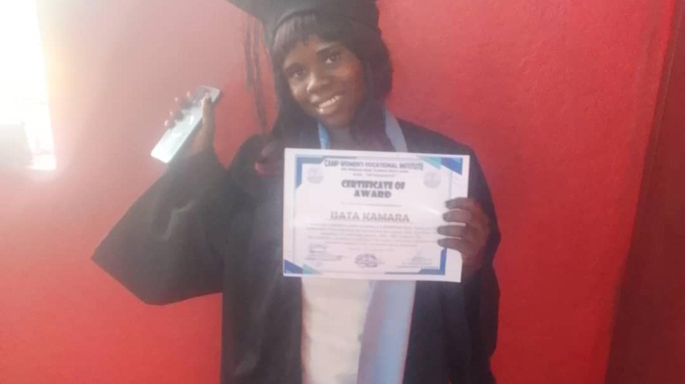 Isata at graduation for Cosmetology