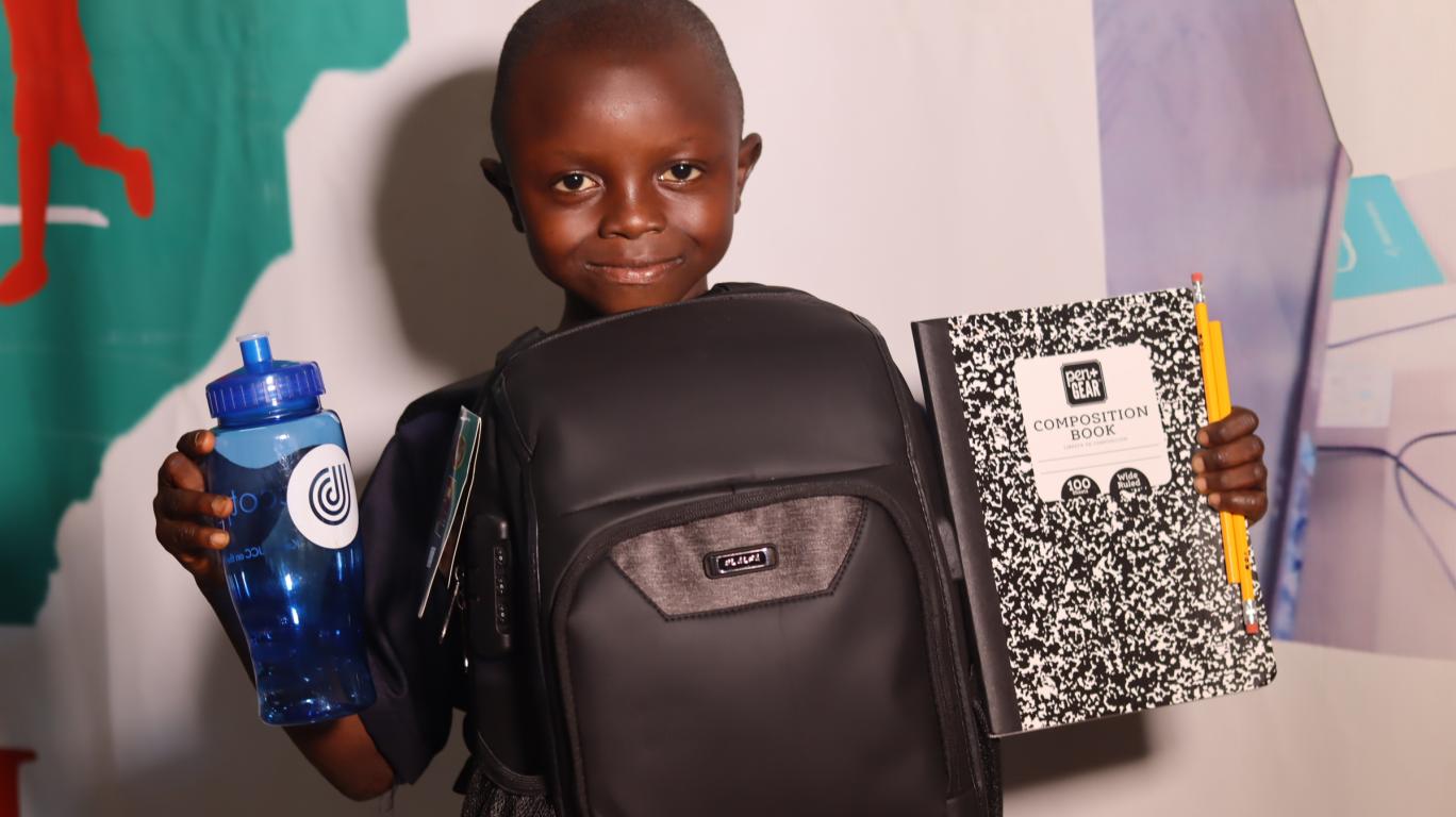 Boy with new school supplies