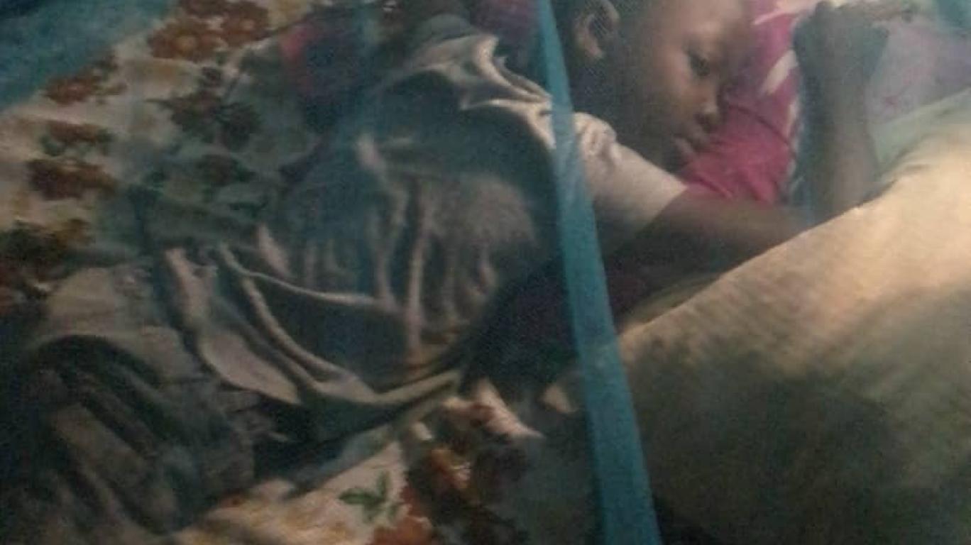 Joseph under his mosquito net