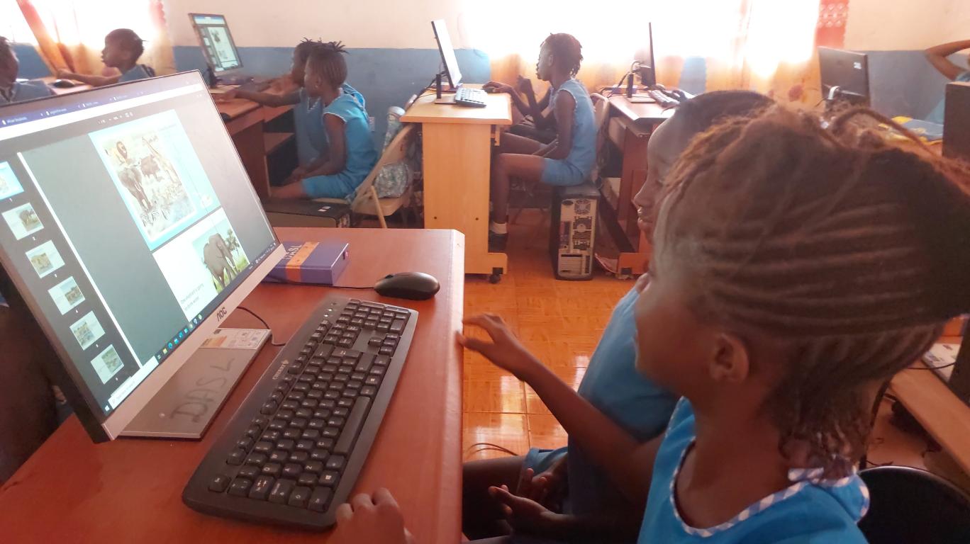 Loretta & Blessing reading "Brown" in class