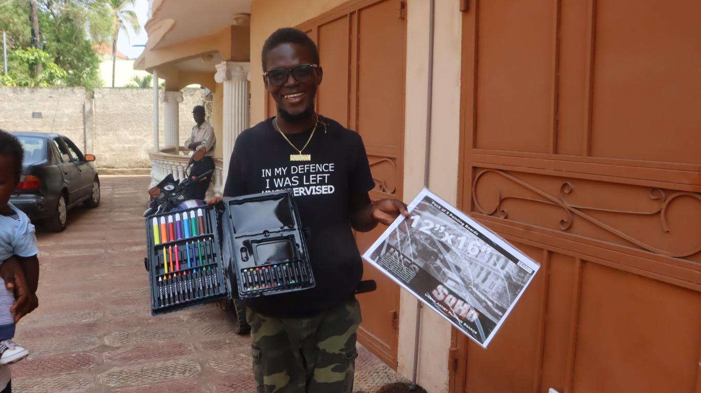 Sahr with his new paint supplies