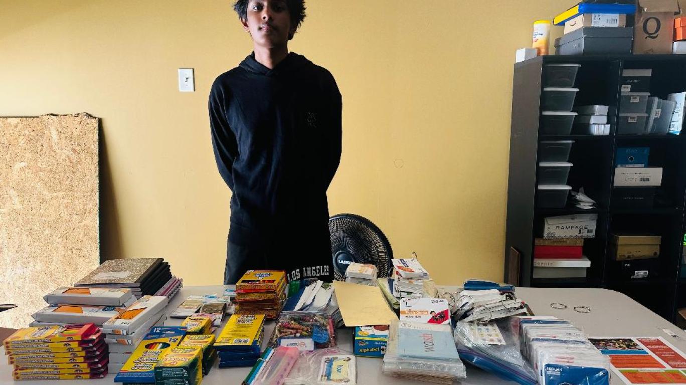 Srihan with school supplies collected