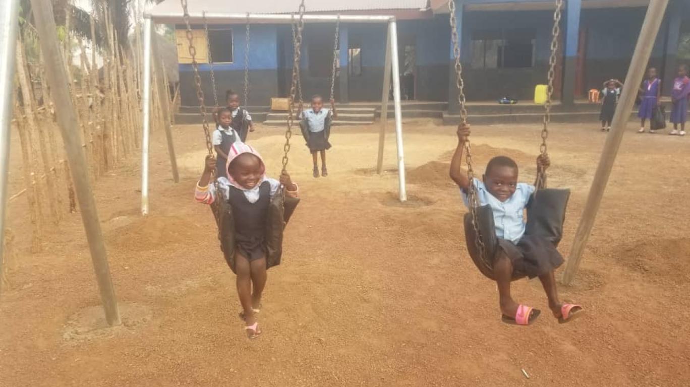 Nursery Children enjoying the new swing set