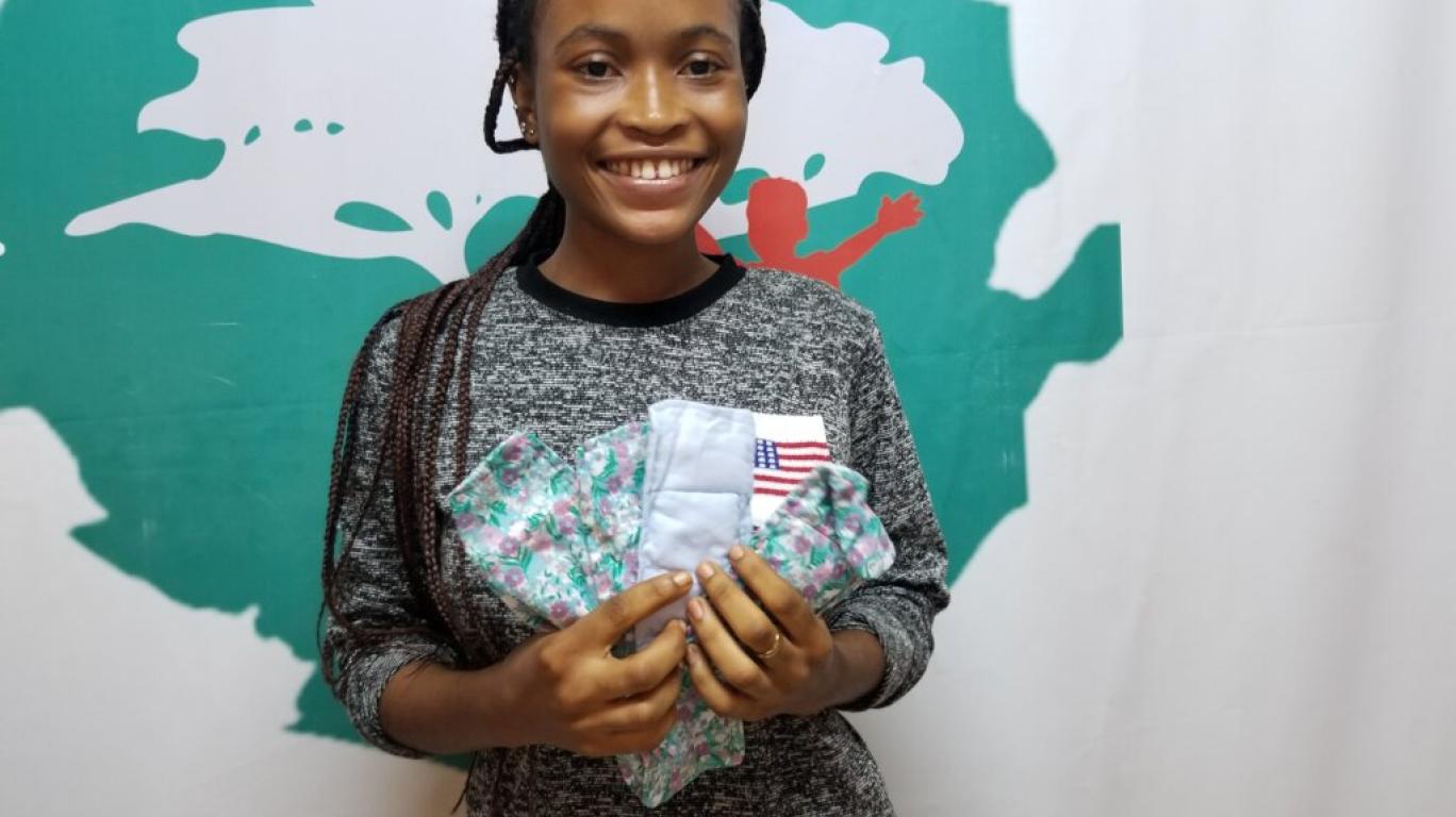 Girl holding reusable sanitary pads